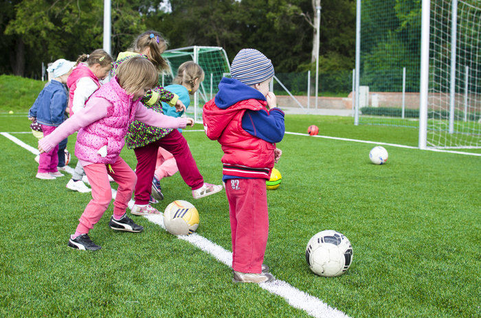 children playing football